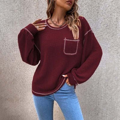 Suéter de punto con bolsillo y cuello redondo en color liso